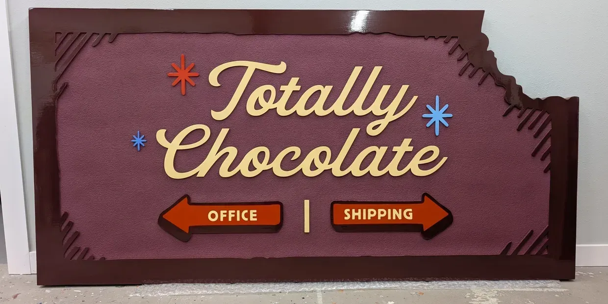 Chocolate sign with “OFFICE” and “SHIPPING” arrows on a brown background created by Valley Sign