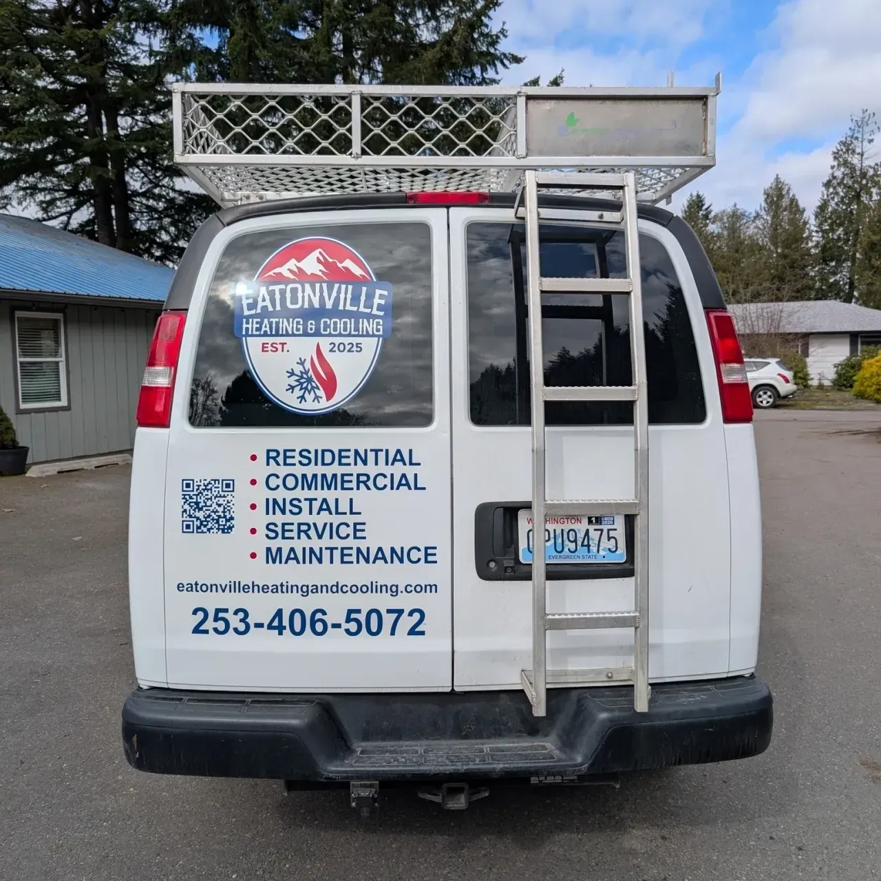 White van with ladder rack, branded for residential, commercial, installation, service, and maintenance.