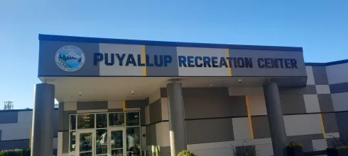 Puyallup Recreation Center building entrance with blue sky and clear signage created by Valley Sign