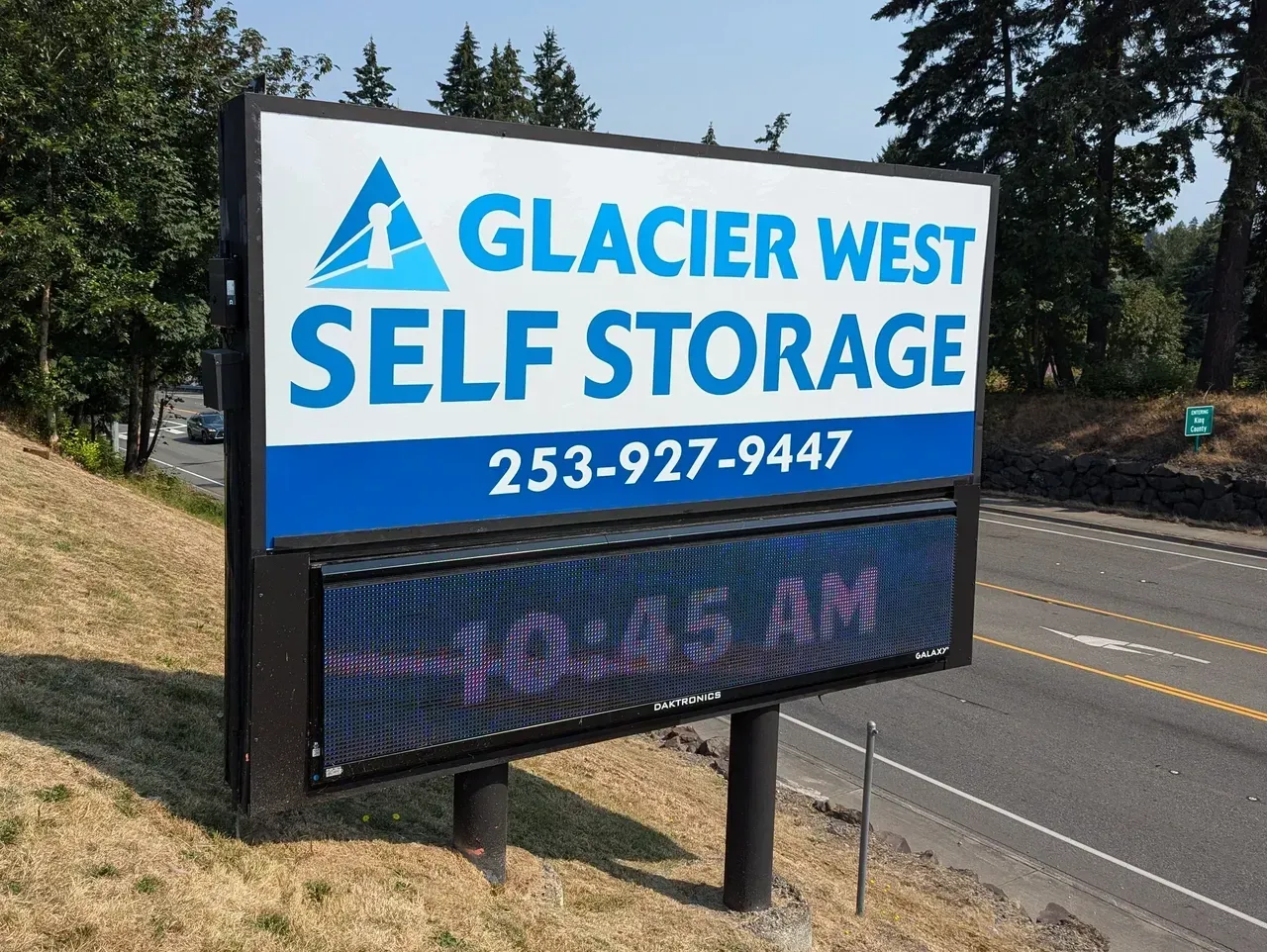 Glacier West Self Storage roadside sign with phone number and digital message board created by Valley Sign