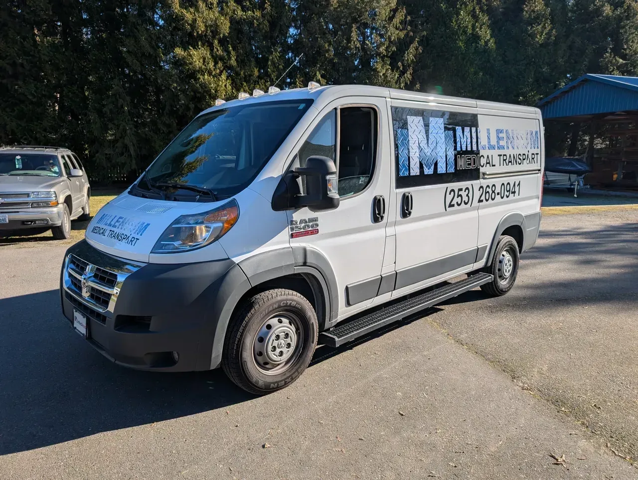 White delivery van parked outdoors with company signage on the side