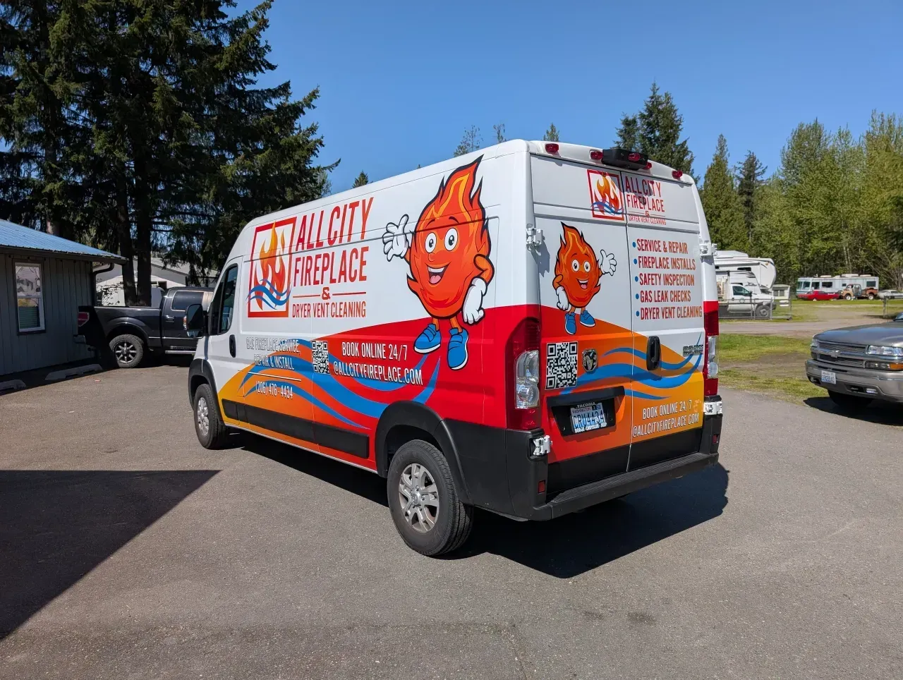 Colorful service van with cartoon fox graphics parked in a lot on a sunny day