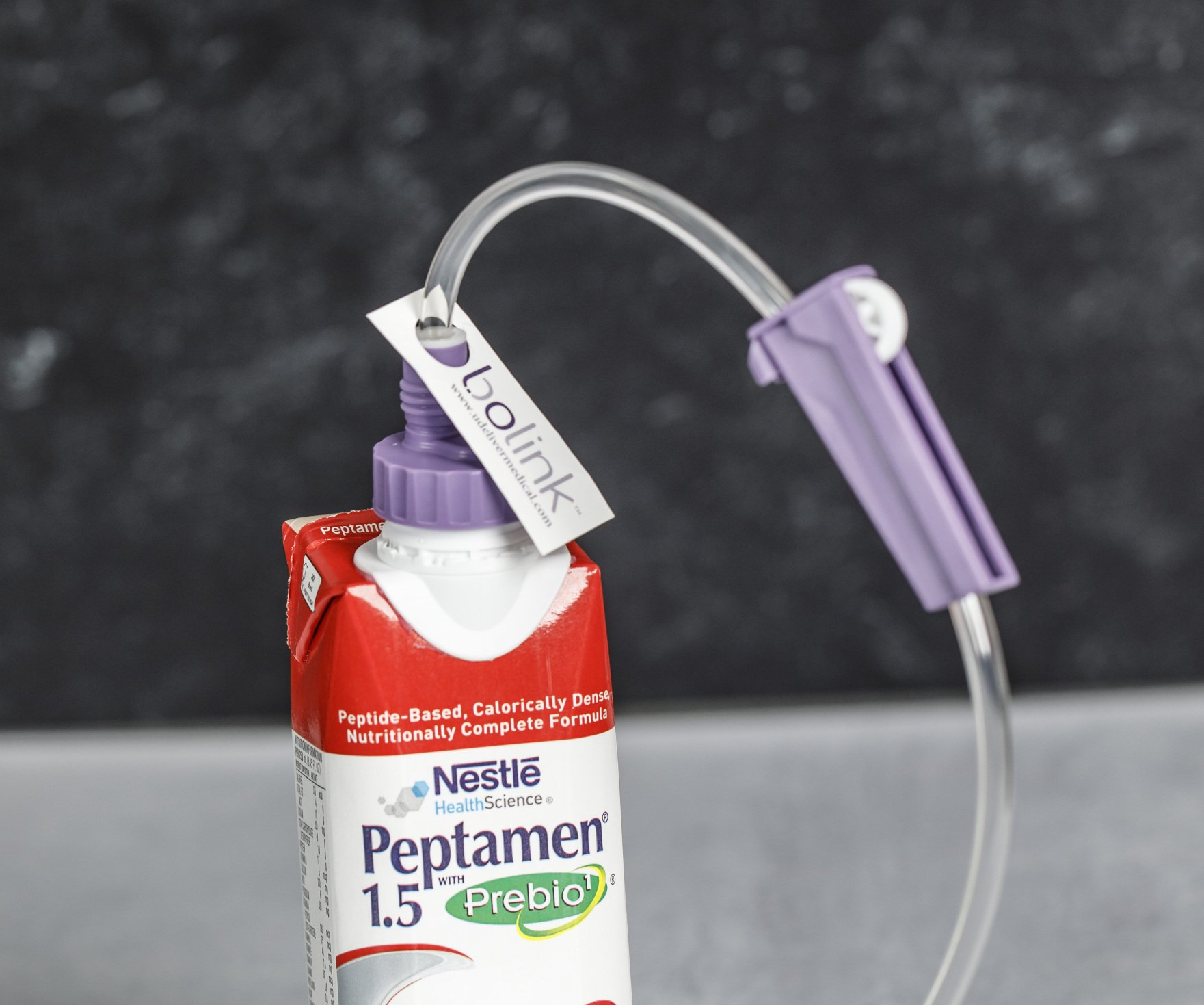 Bolink D Cap connected to a Peptamen carton