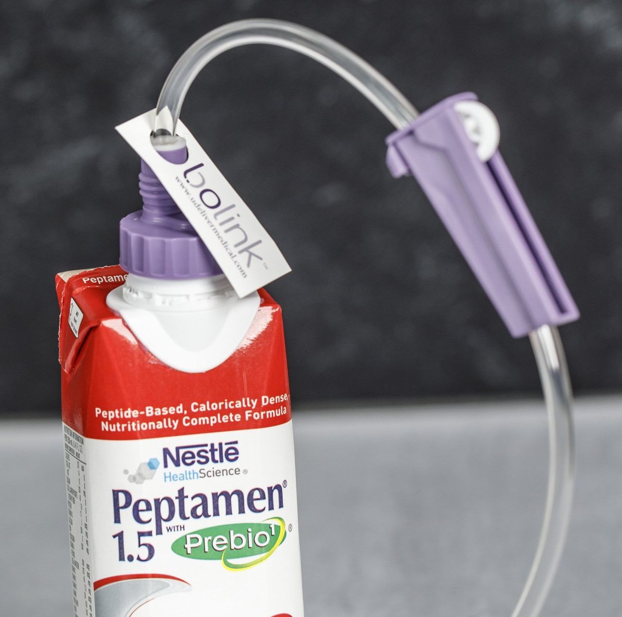 Bolink D Cap connected a carton of Peptamen