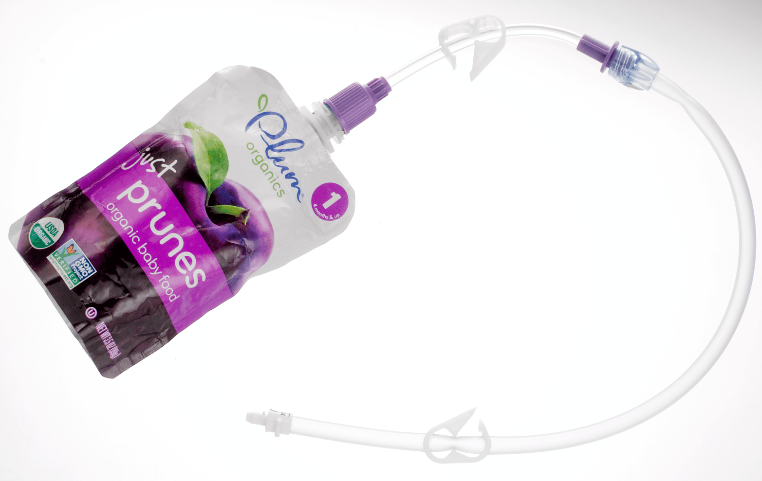 Bolink Small Cap connected to a pouch of puree prunes and a bolus extension set