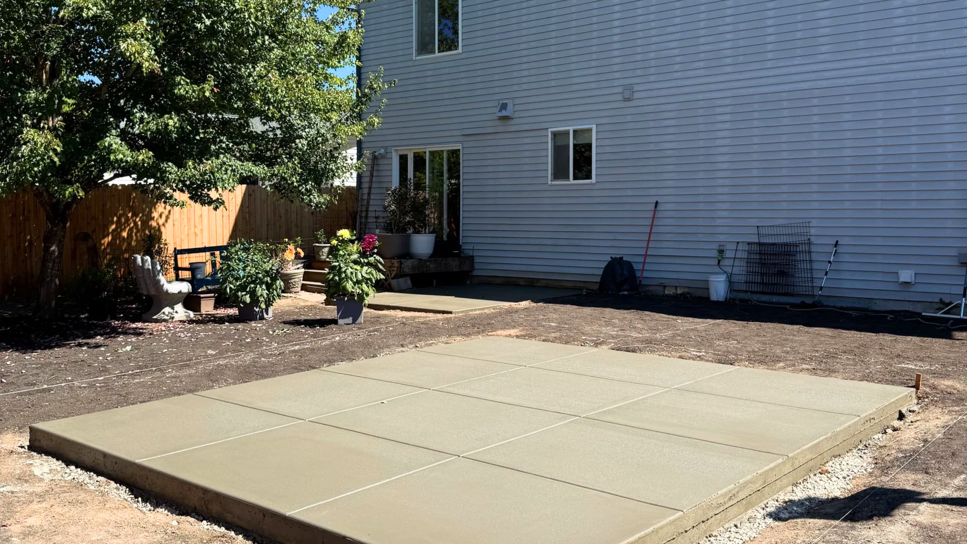 Freshly poured garage slab inside a wood-framed shop building in Vancouver, Washington