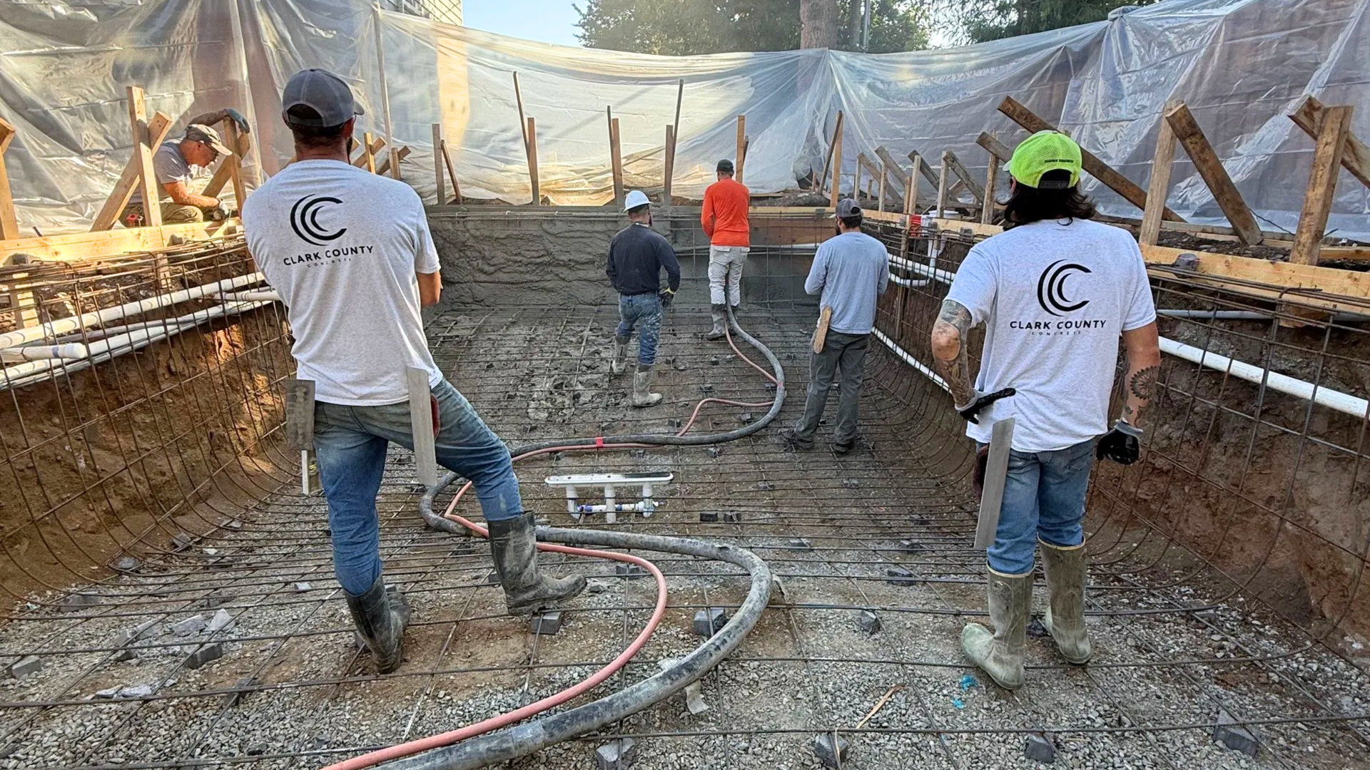Fresh concrete slab protected by insulated curing blankets during winter in Clark County, Washington