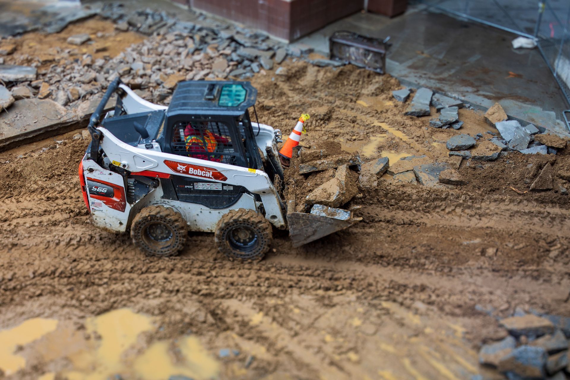 Skid steer loader on a job site, one of the equipment types covered by UFSS operator certification