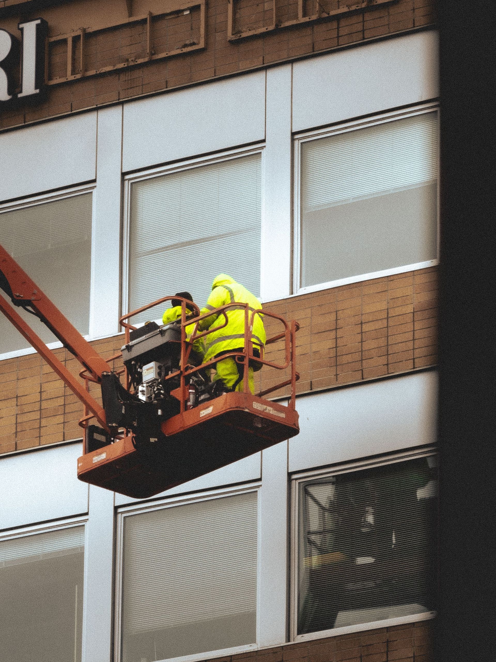 Operator working from an aerial boom lift basket, another equipment type UFSS certifies operators on
