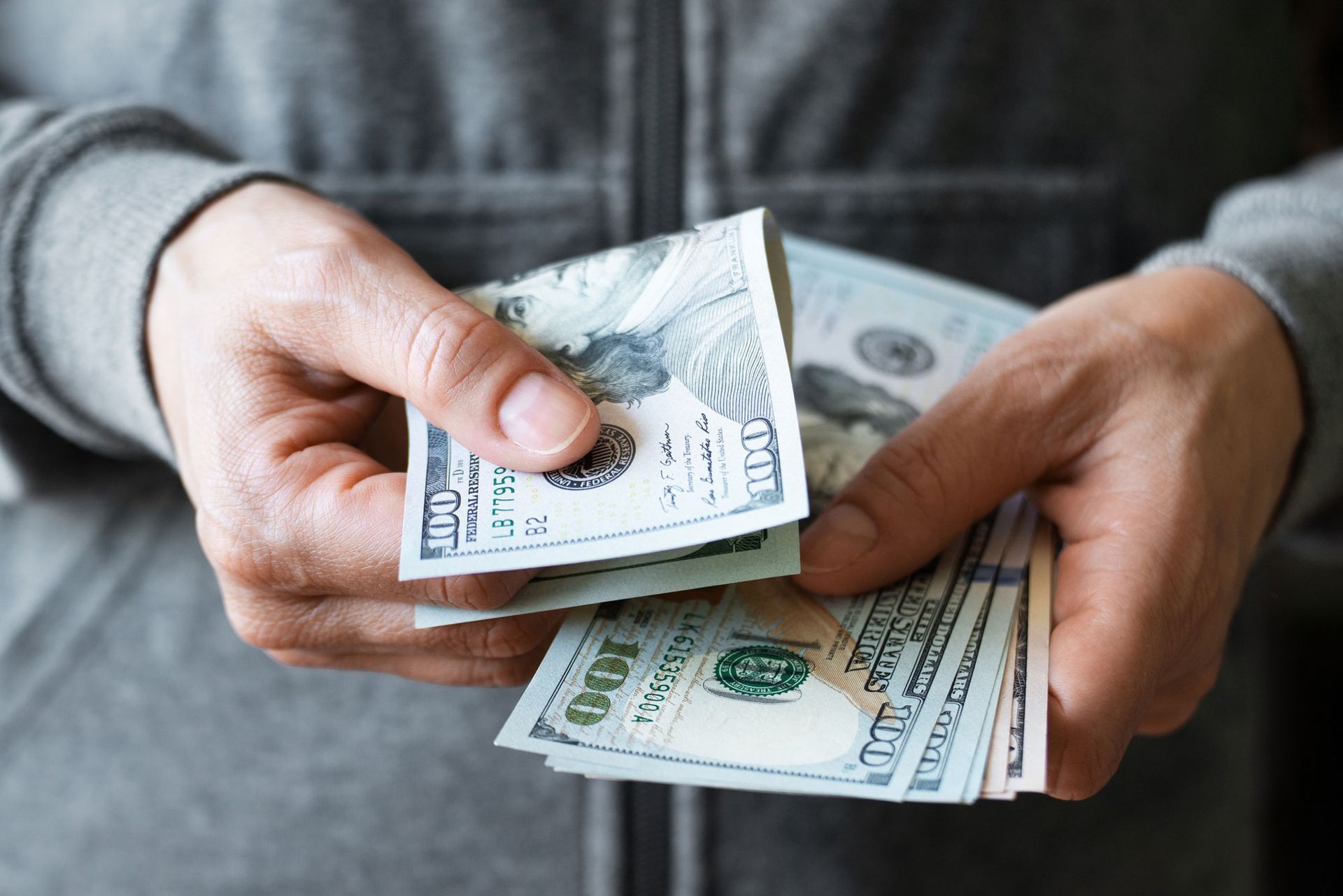 Photo of person holding cash