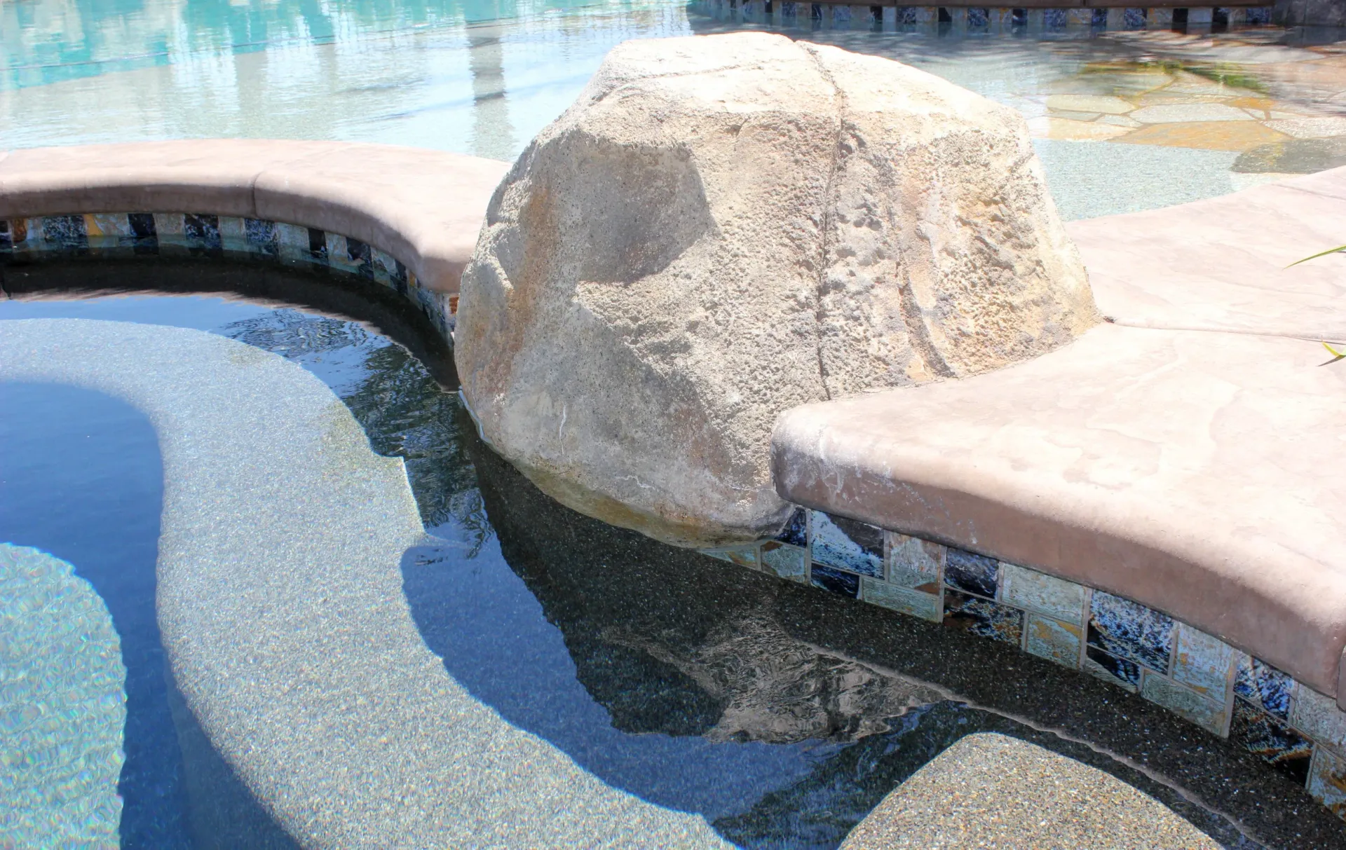 Superior Concrete Construction stamped concrete pool deck installation
