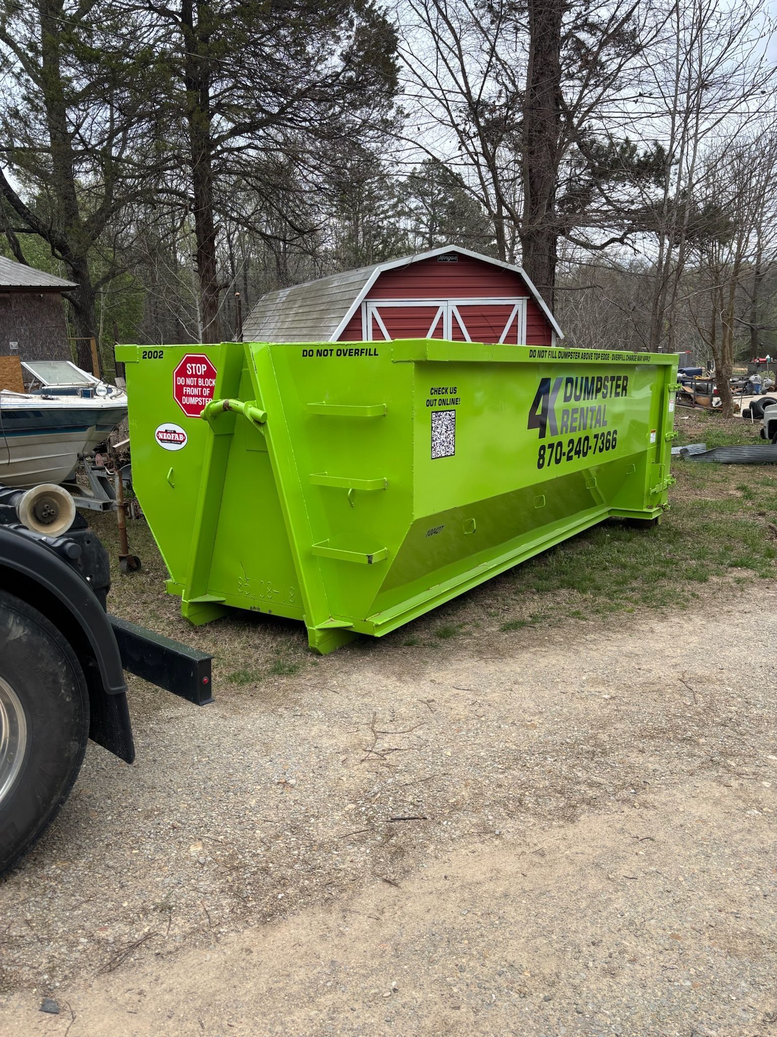 Roll-off dumpster placed carefully on a residential driveway in Northeast Arkansas