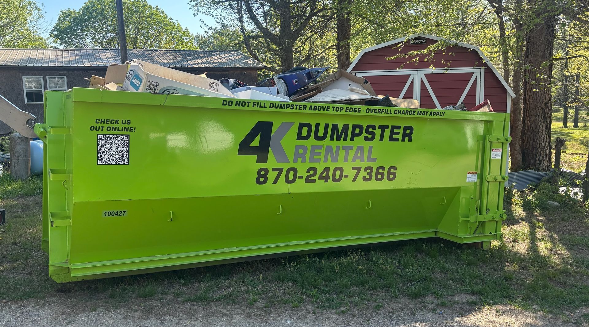 4K Dumpster Rental roll-off dumpster on a residential property cleanup in Northeast Arkansas