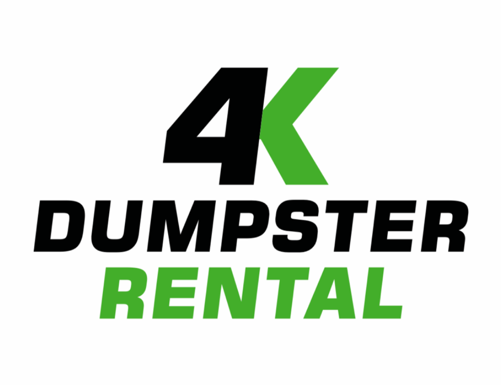 A row of dumpsters are parked in a gravel lot.