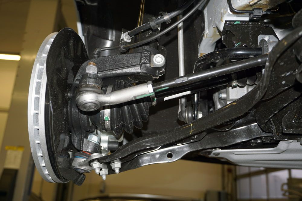 A Close Up of the Steering Mechanism of a Car With a Brake Disc — Motortorque Automotive in South Grafton, NSW