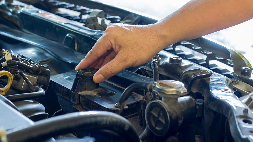A Person is Working on the Radiator of a Car — Motortorque Automotive in South Grafton, NSW