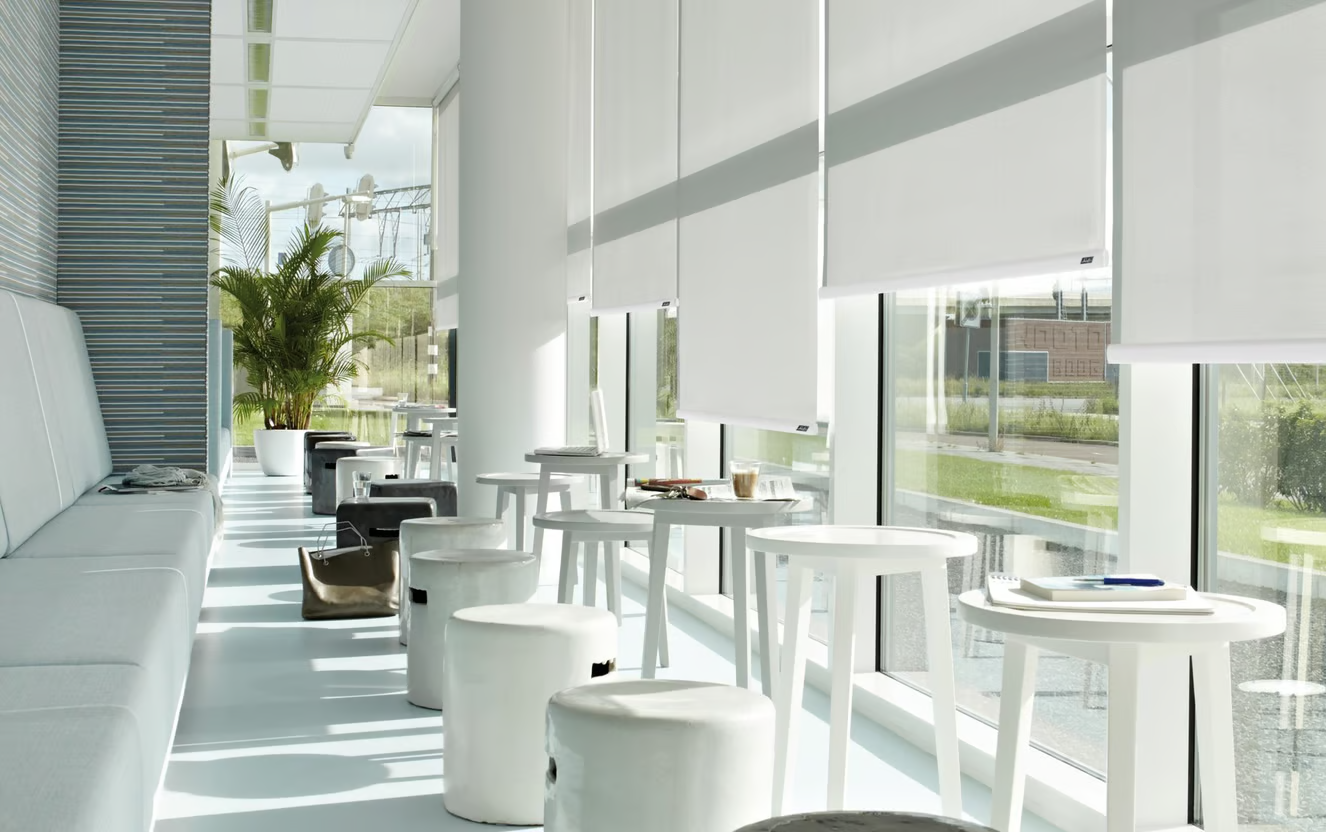 A room with elegant roller blinds to protect the furniture against the harsh South African Sun.