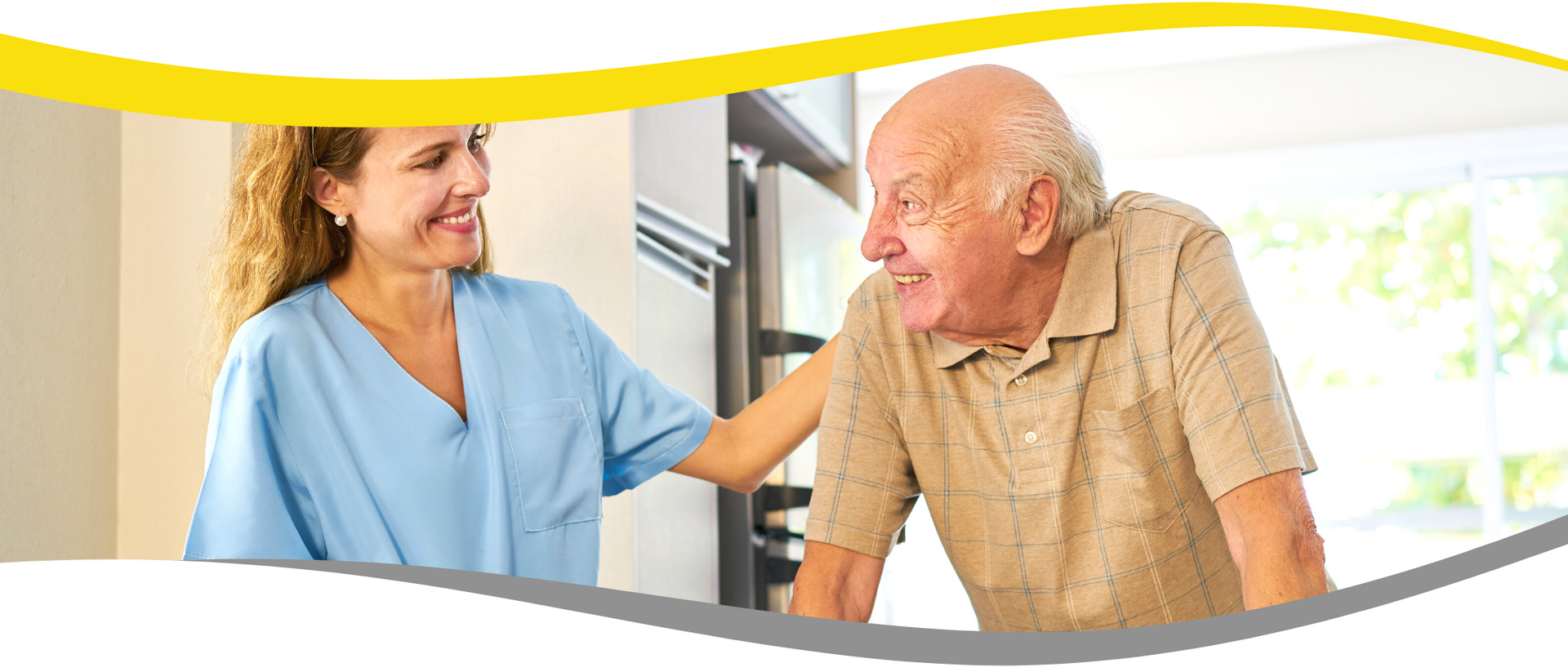 A nurse is helping an elderly man walk down stairs.