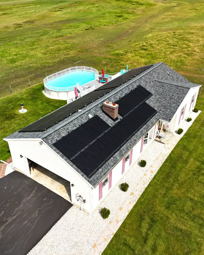 Quantum Roofing & Restoration completed asphalt shingle roof with solar panels on a Havre de Grace, MD home