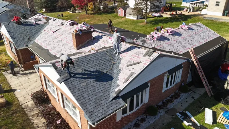 Quantum Roofing & Restoration crew completing a full roof replacement on a Havre de Grace, MD home