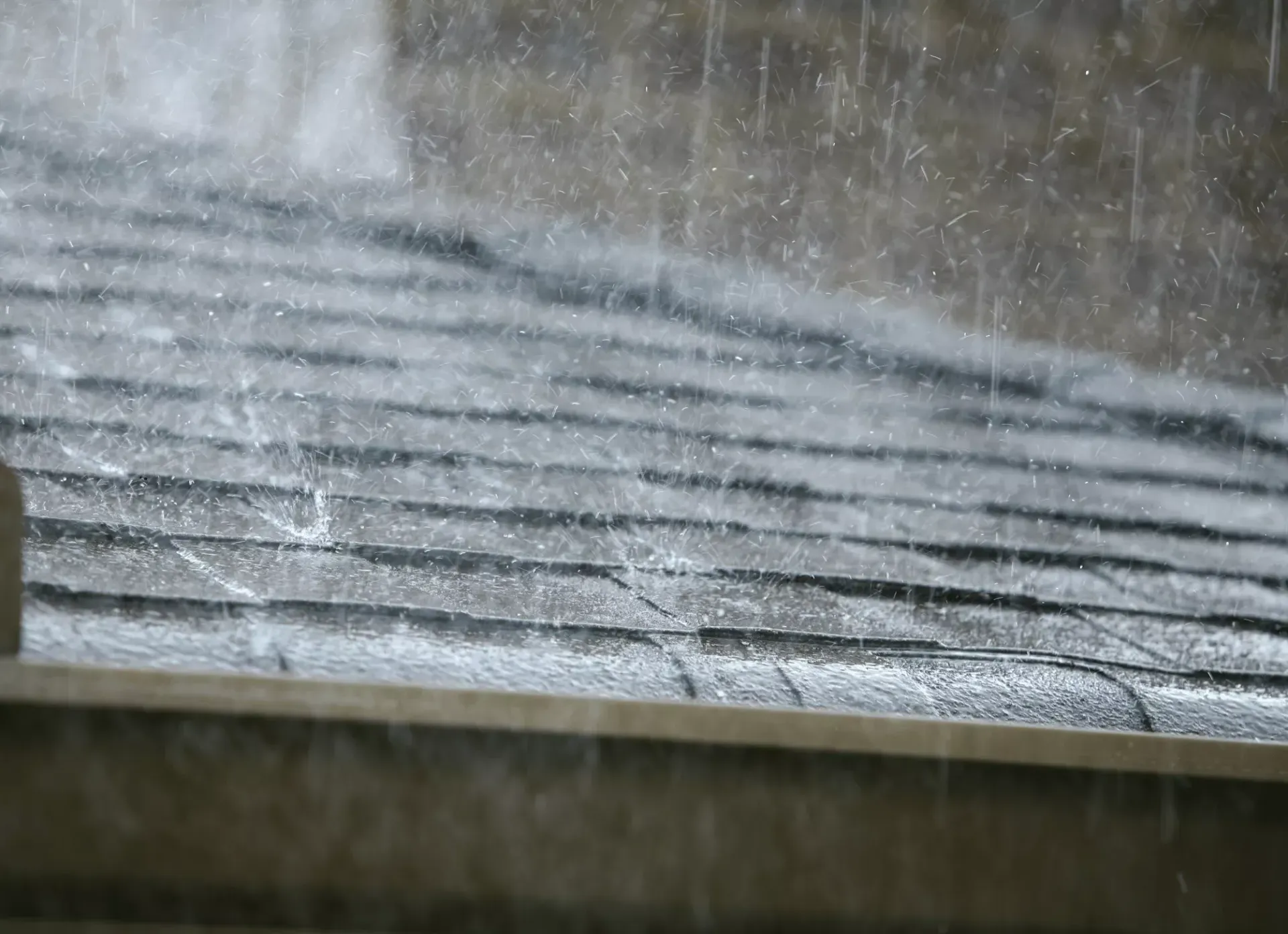 Heavy rain falling on a Maryland home during a storm