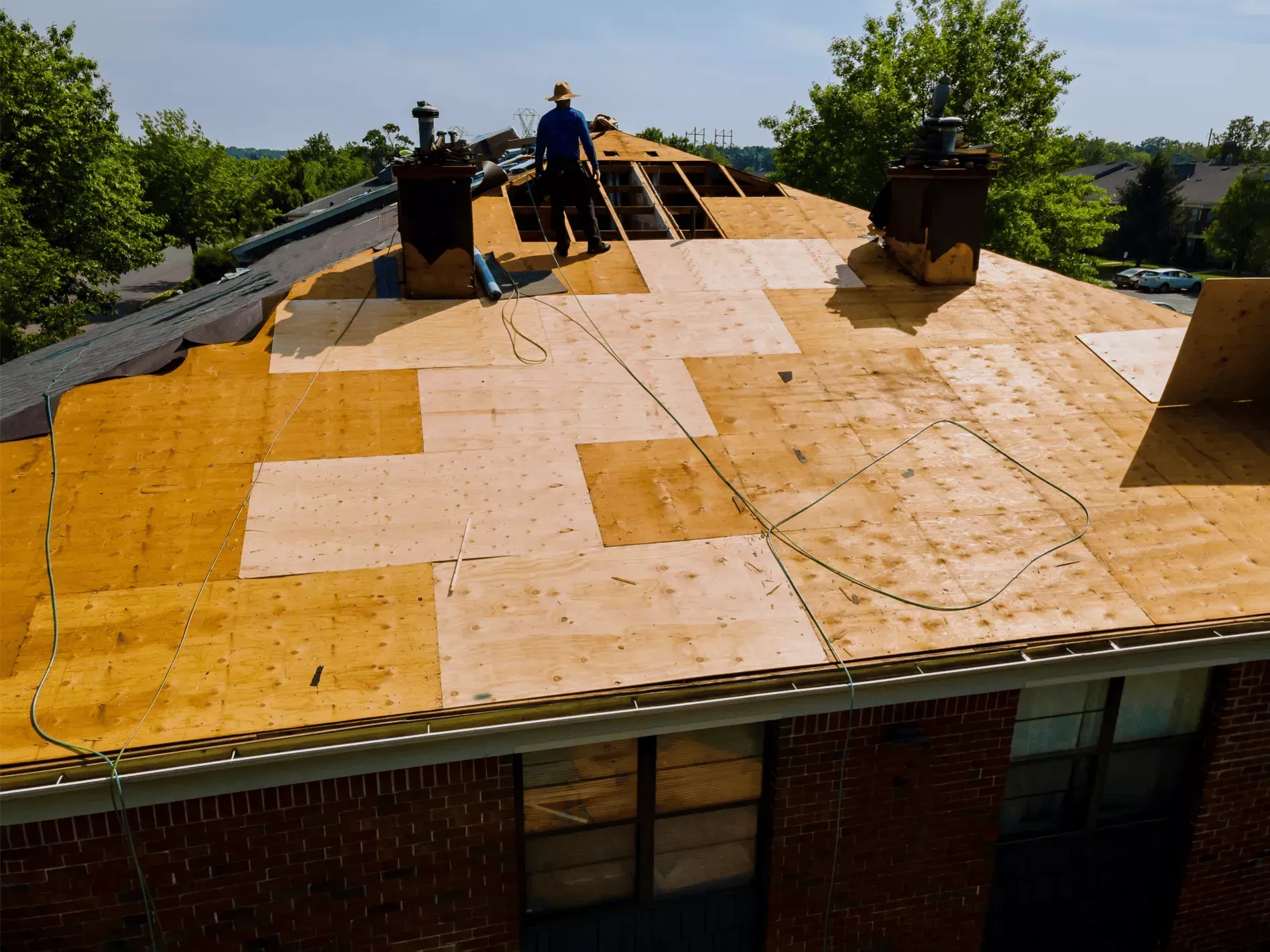 Quantum Roofing & Restoration crew installing plywood roof decking during a replacement in Havre de Grace, MD