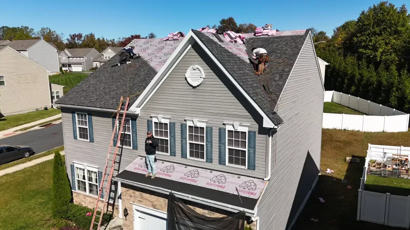 Quantum Roofing & Restoration crew replacing a roof on a Havre de Grace, MD home with underlayment installed