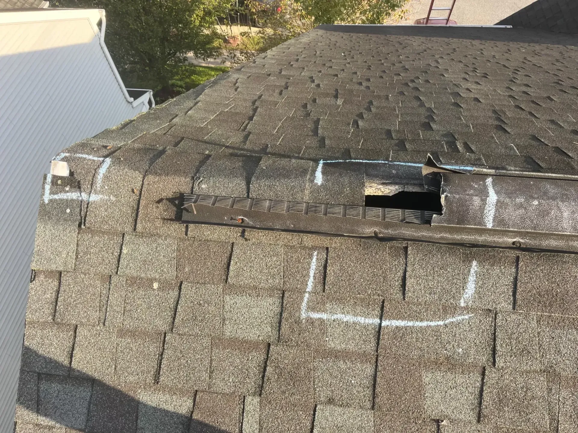 Damaged roof vent with inspection markings on a Havre de Grace, MD home prior to repair
