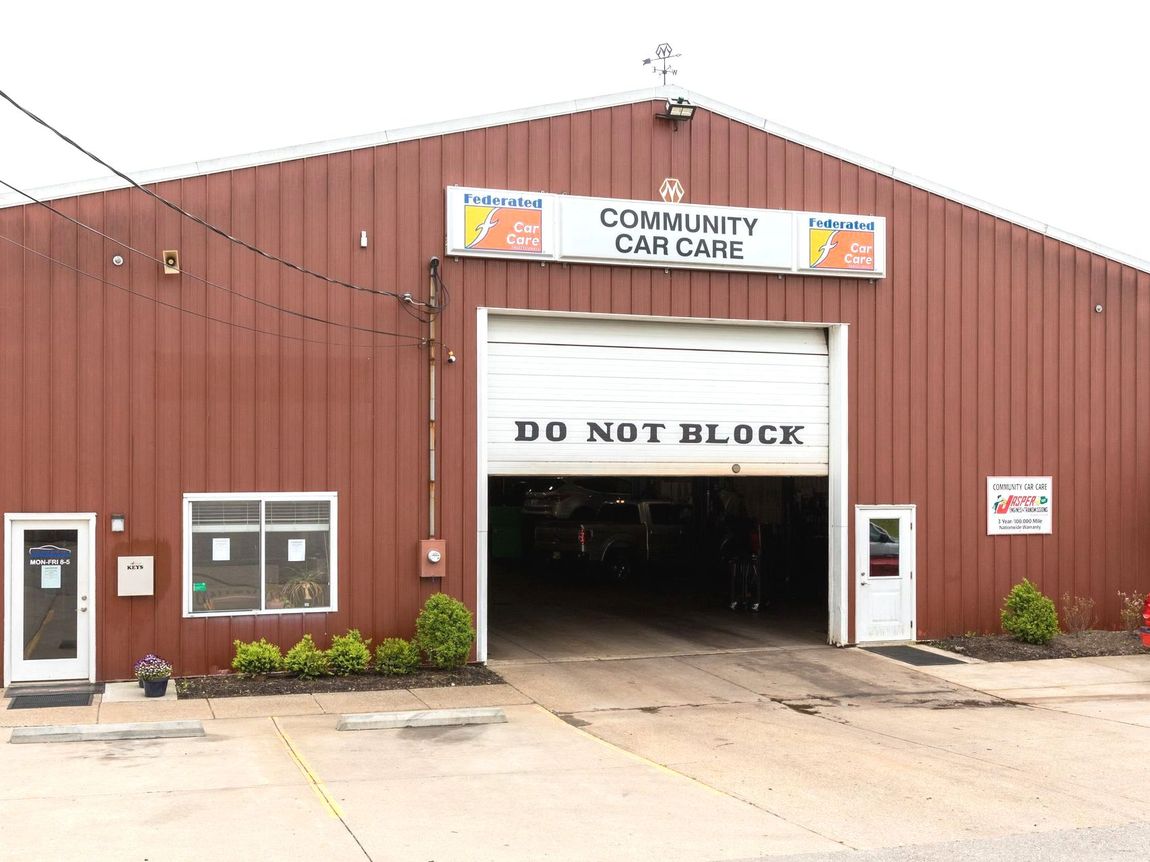 Community car care garage with open bay and 