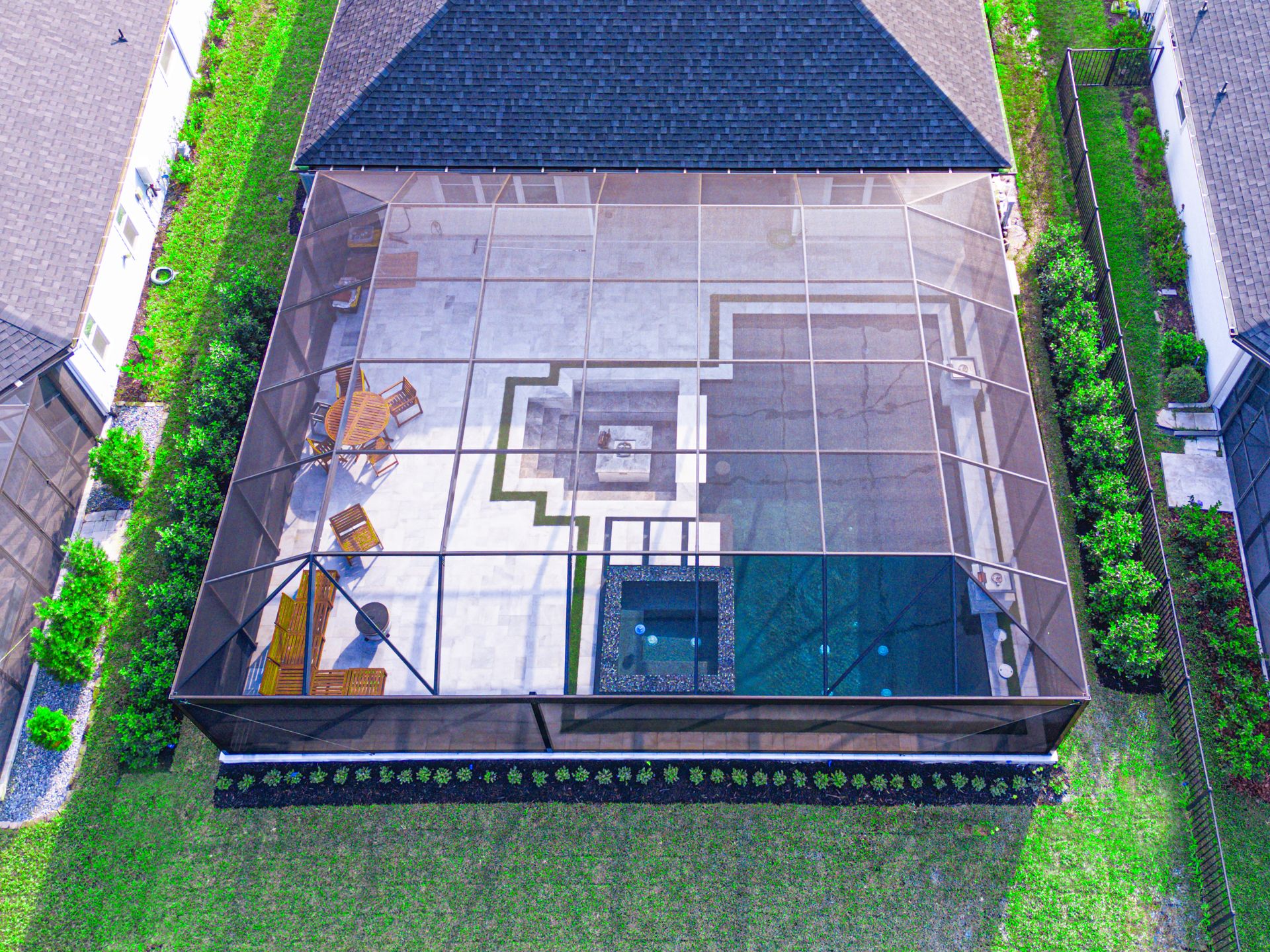 Modern house with pool, lawn, and sky; two-story, white with balcony.