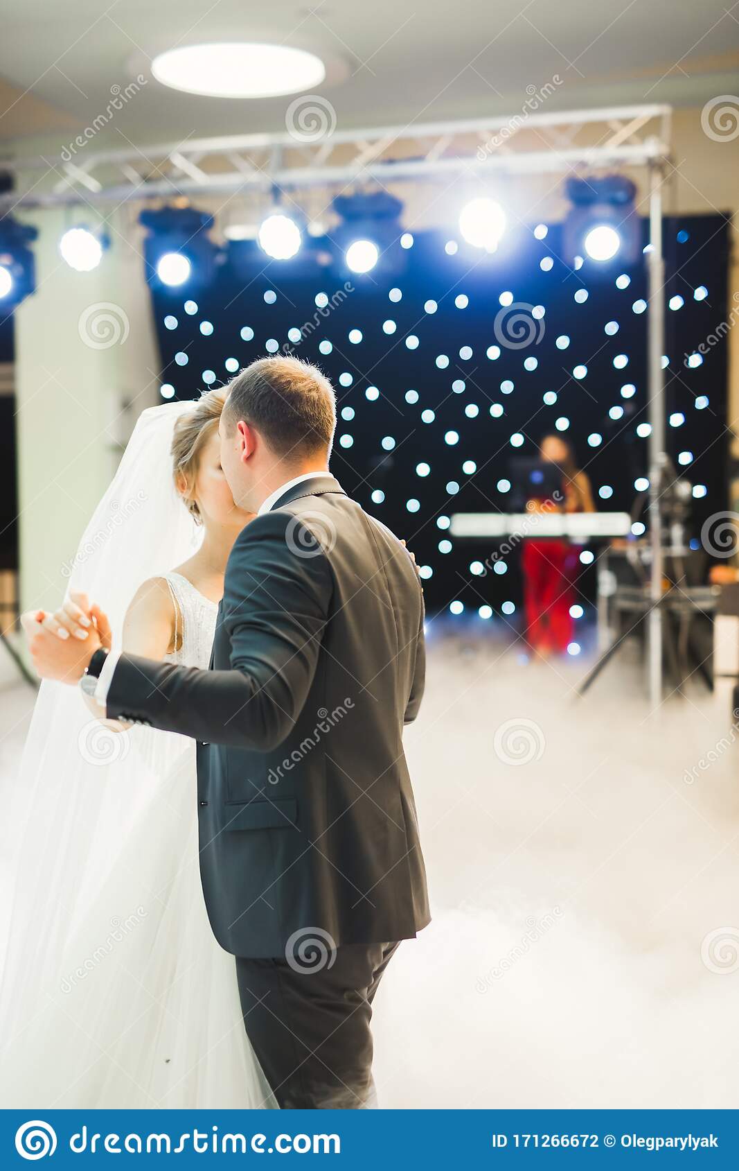 First dance of the bride and groom on dance-floor