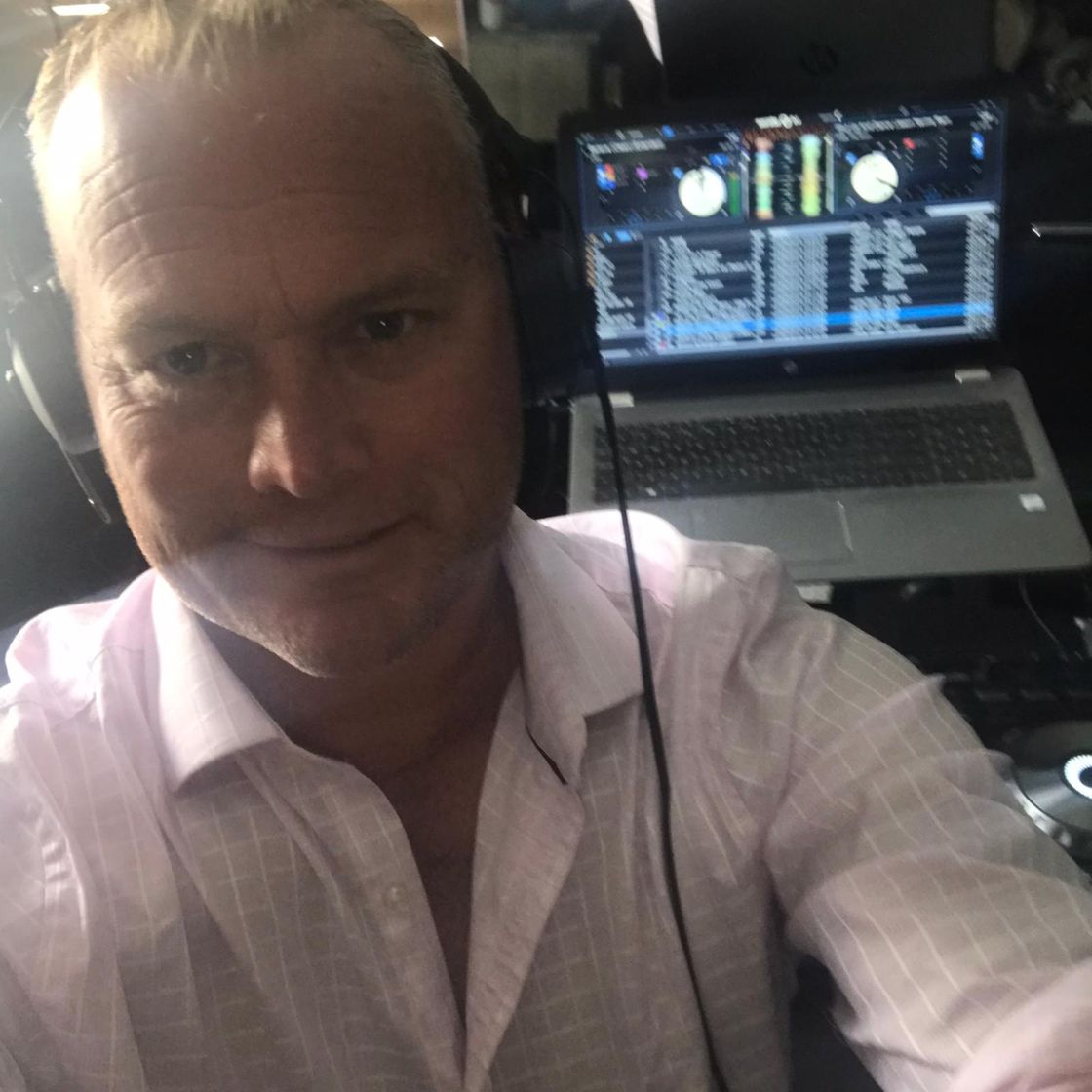 Photo of our main Wedding D, Greg at the decks mixing music