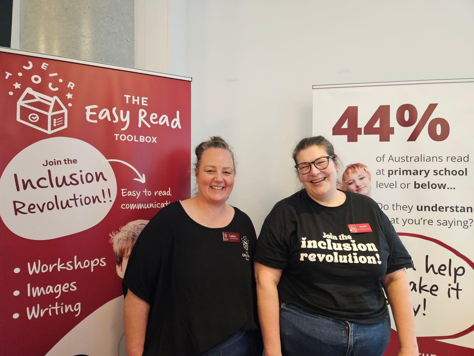 Ladina and Karen smiling into camera at The Easy Read Toolbox stall at SECNA 2025