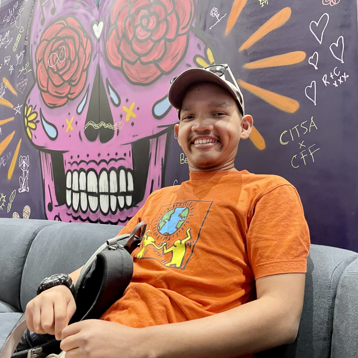 Headshot of Joshua Devan smiling at the camera