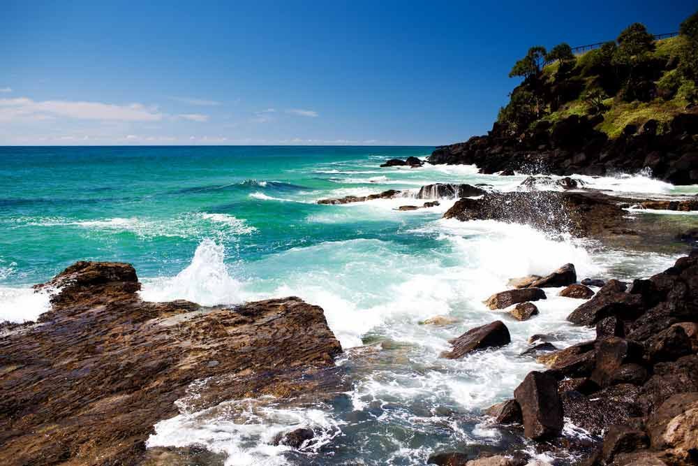 Waves Crashing Against A Rocky Shoreline — Kingscliff Tweed Coast Taxis Pty Ltd In Kingscliff, NSW