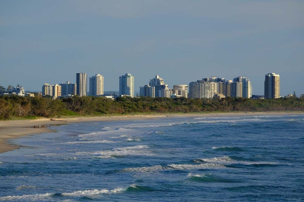 A Beach With A City Skyline In The Background — Kingscliff Tweed Coast Taxis Pty Ltd In Tweed Heads, NSW