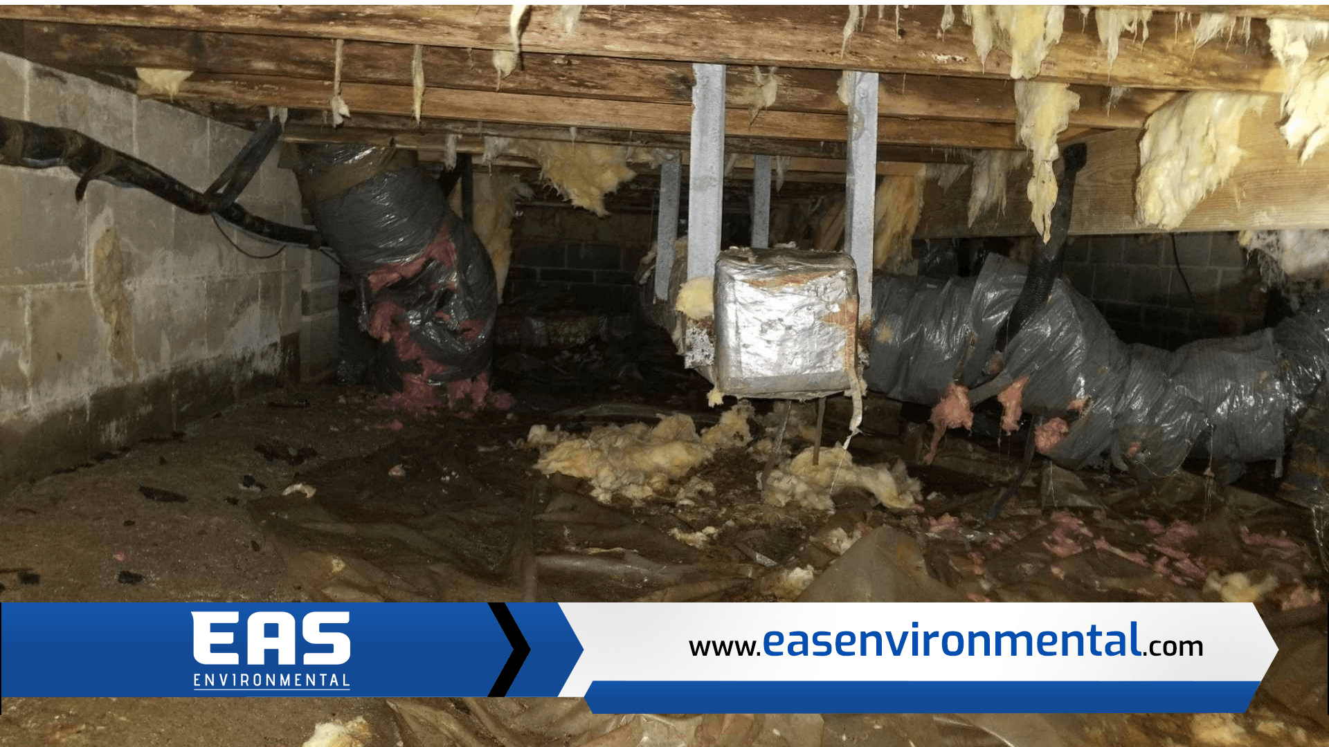 Crawl space with ductwork and insulation; potential water damage visible.