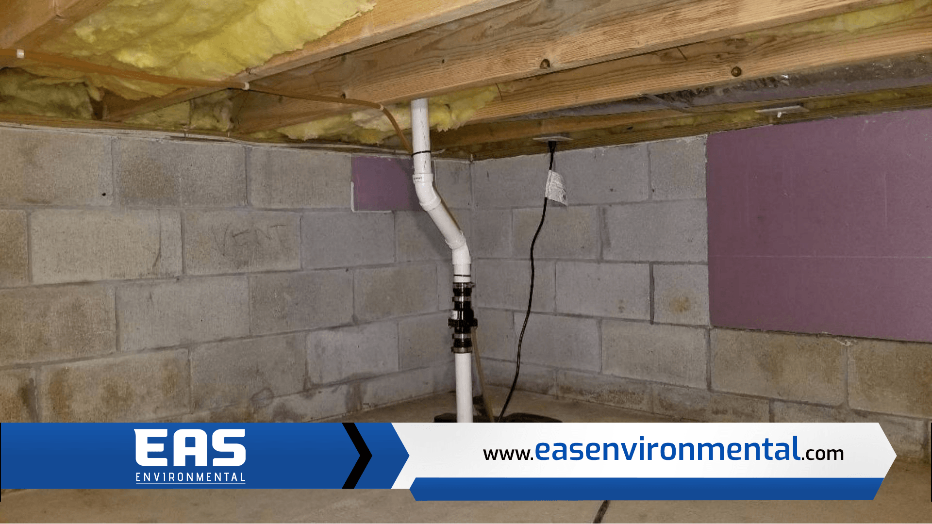 Basement interior showing cinder block walls, insulation, and a sump pump system.