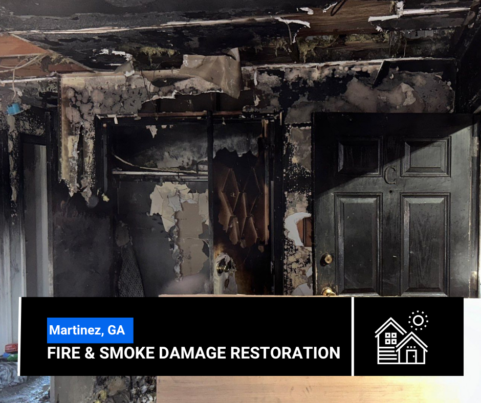 Fire-damaged interior of a building in Martinez, GA. Blackened walls, door, and ceiling from smoke and fire.