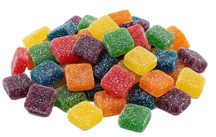 Pile of colorful sugar-coated gummy candies on a white background