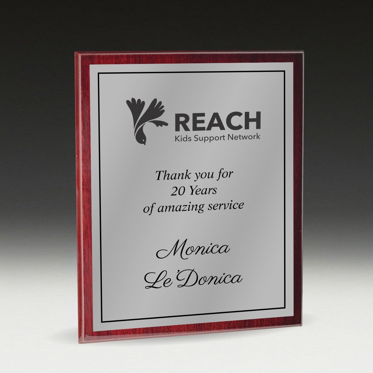 Various awards and desk accessories, including a silver tray, clock, and engraved plaques — NQ Plaques & Trophies In Mount Isa, QLD