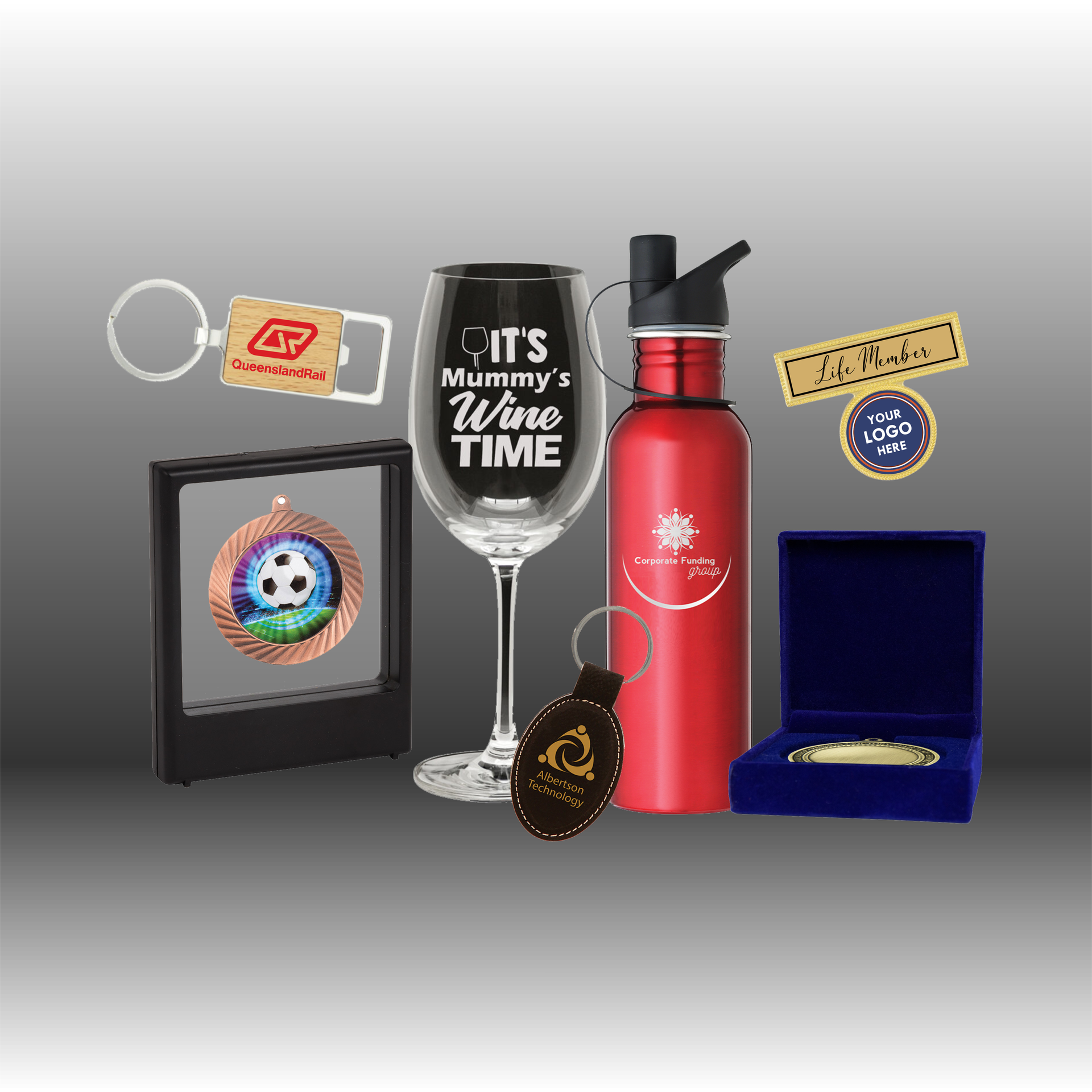 Various awards and desk accessories, including a silver tray, clock, and engraved plaques — NQ Plaques & Trophies In Mount Isa, QLD
