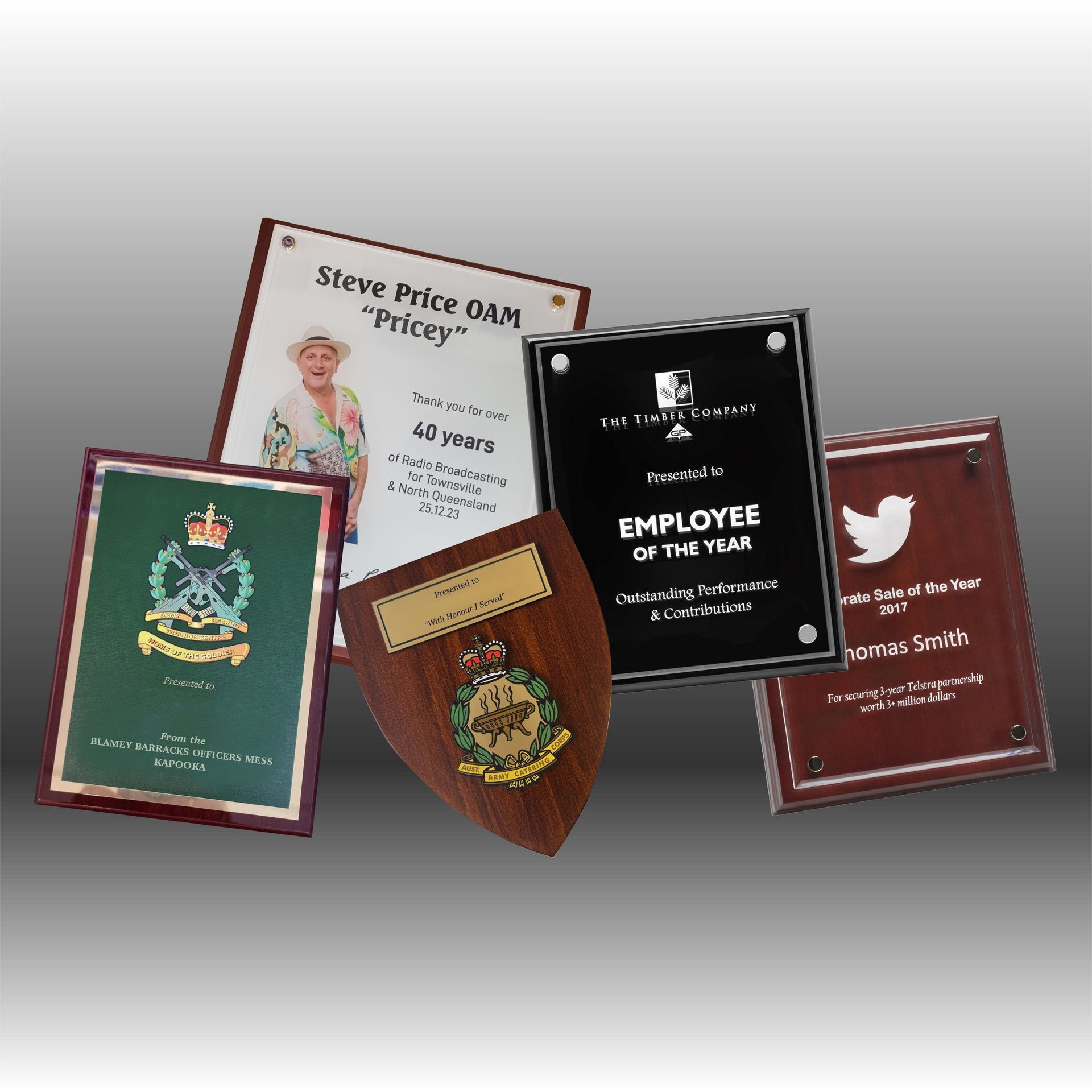 Various awards and desk accessories, including a silver tray, clock, and engraved plaques — NQ Plaques & Trophies In Mount Isa, QLD