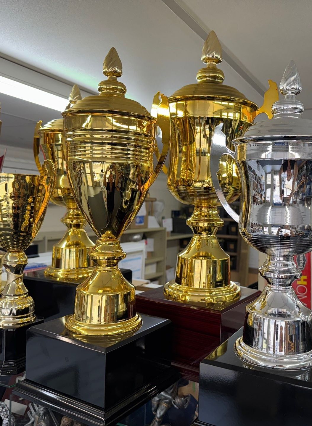 Various awards and desk accessories, including a silver tray, clock, and engraved plaques — NQ Plaques & Trophies In Mount Isa, QLD