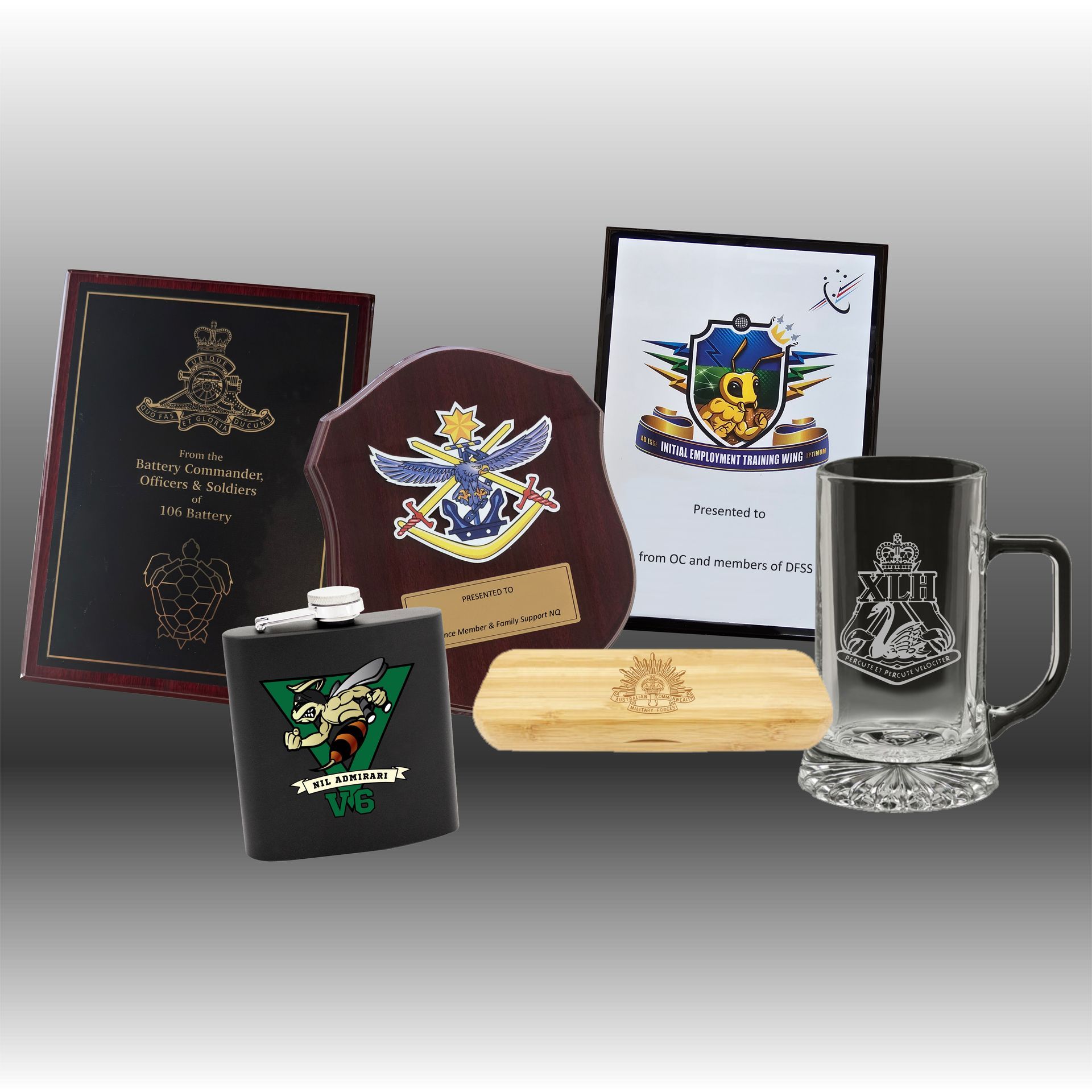 Various awards and desk accessories, including a silver tray, clock, and engraved plaques — NQ Plaques & Trophies In Mount Isa, QLD