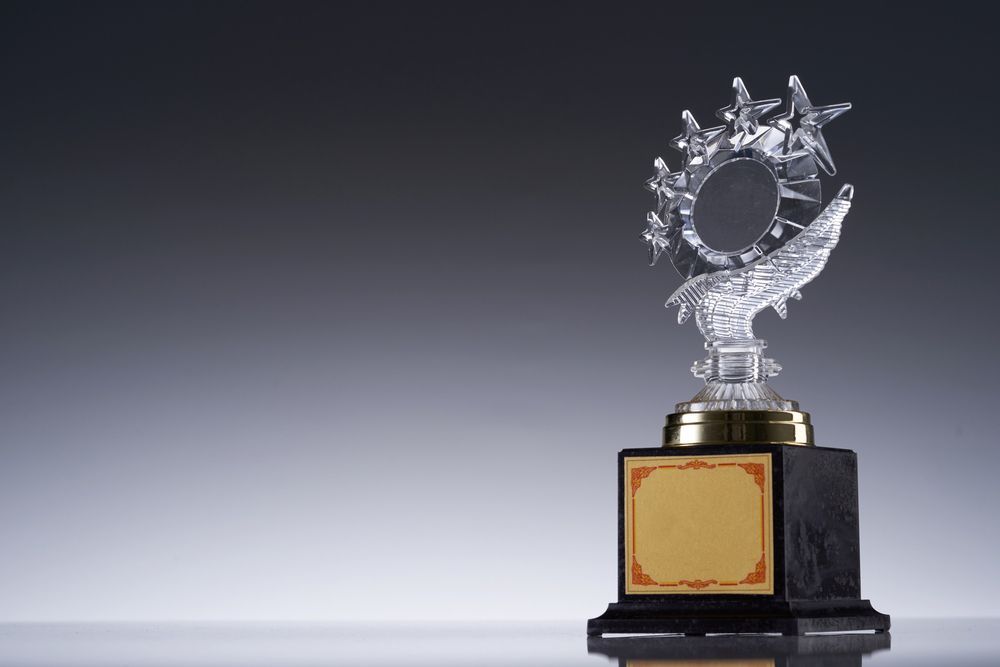 A Trophy With A Circle On Top Of It Is Sitting On A Table — NQ Plaques & Trophies In Mackay, QLD