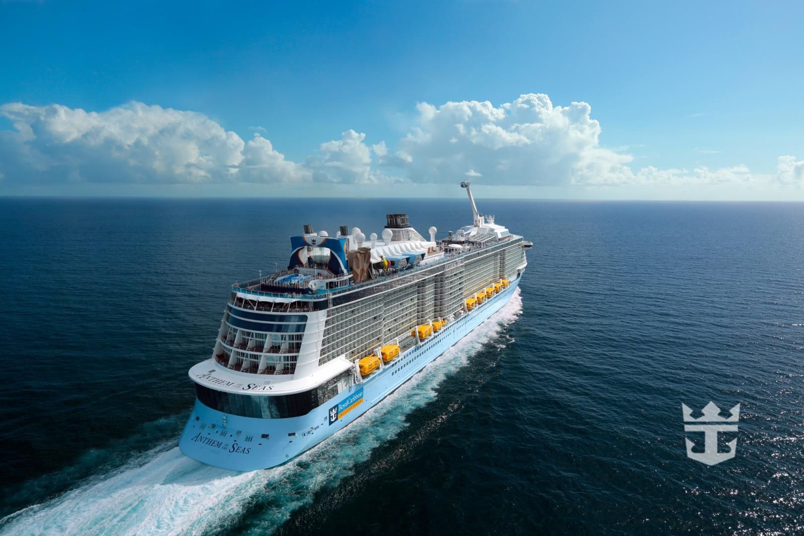 A large cruise ship is floating on top of a large body of water.