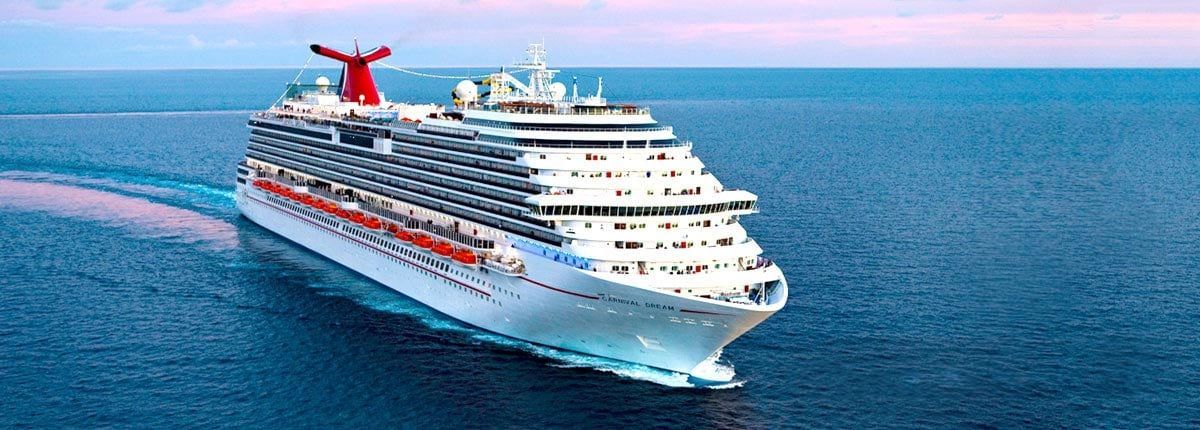 A large cruise ship is floating on top of a body of water.
