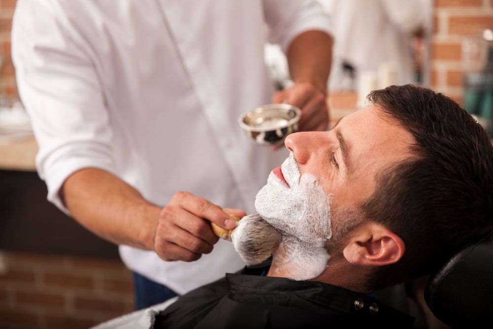 Barber Shaving a Man’s Face with A Straight Razor — Ultimate Barber in Maryborough, QLD