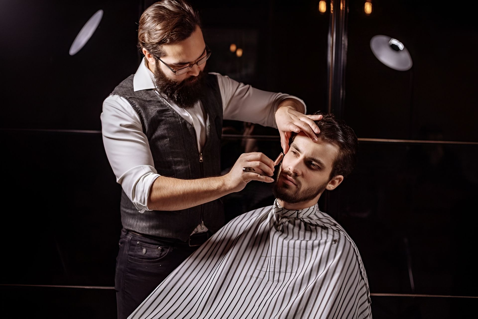 Barber Trimming a Seated Client’s Beard — Ultimate Barber in Maryborough, QLD
